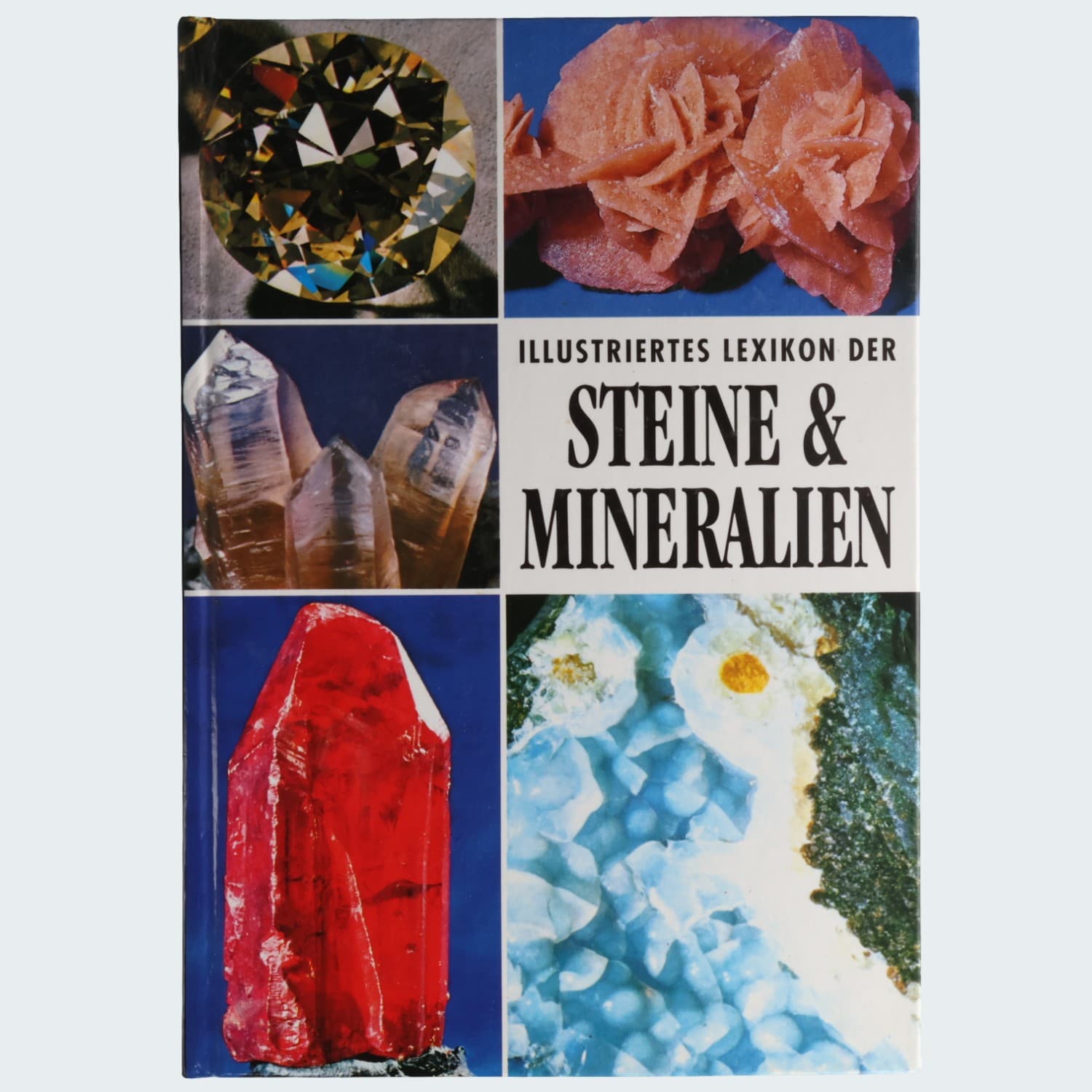 Illustriertes Lexikon der Steine & Mineralien – Vorderseite mit Diamant, Wüstenrose, Bergkristall und Rubin