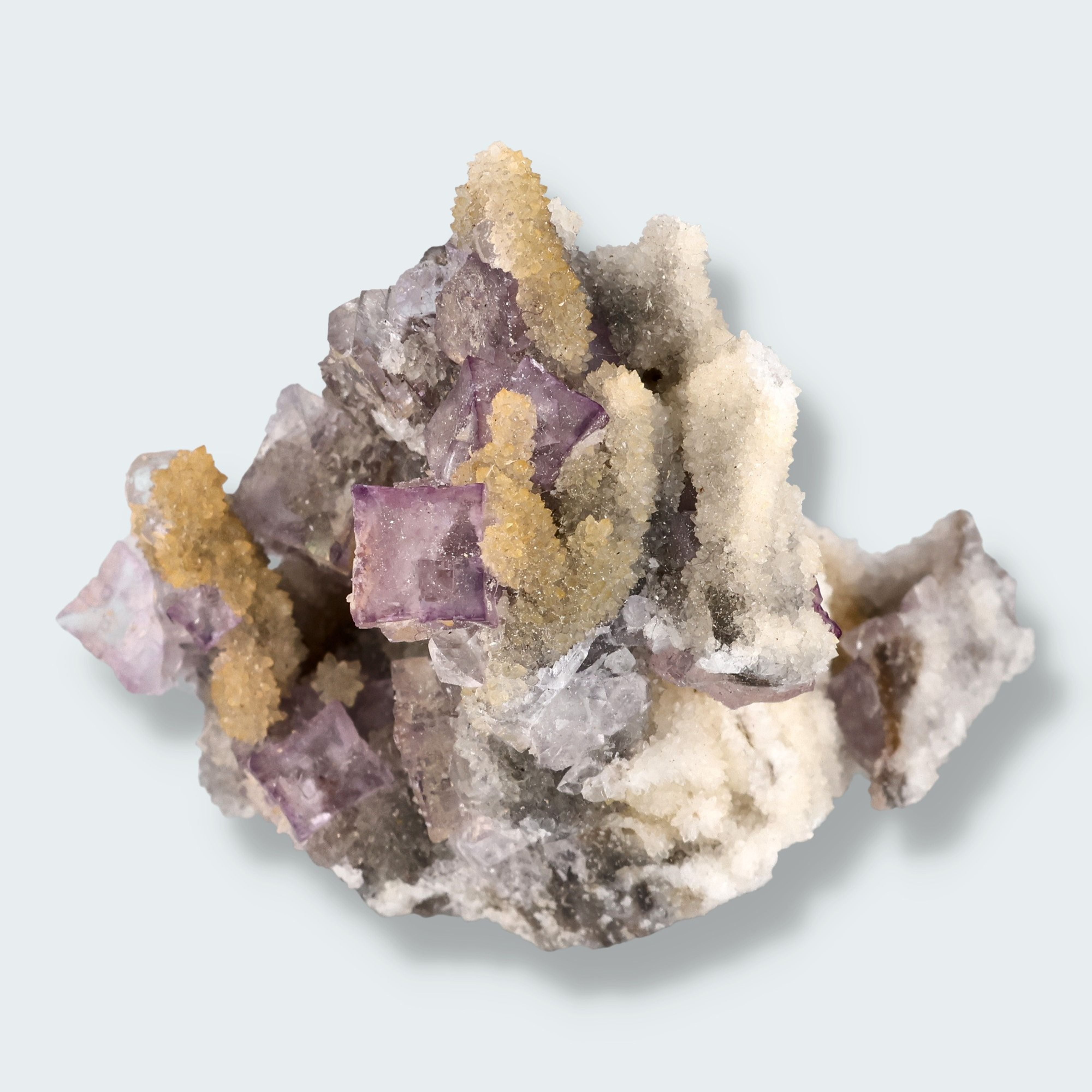 Violetter Fluorit aus Mexiko mit weissen und gelben Quarz Anlagerungen (80g)