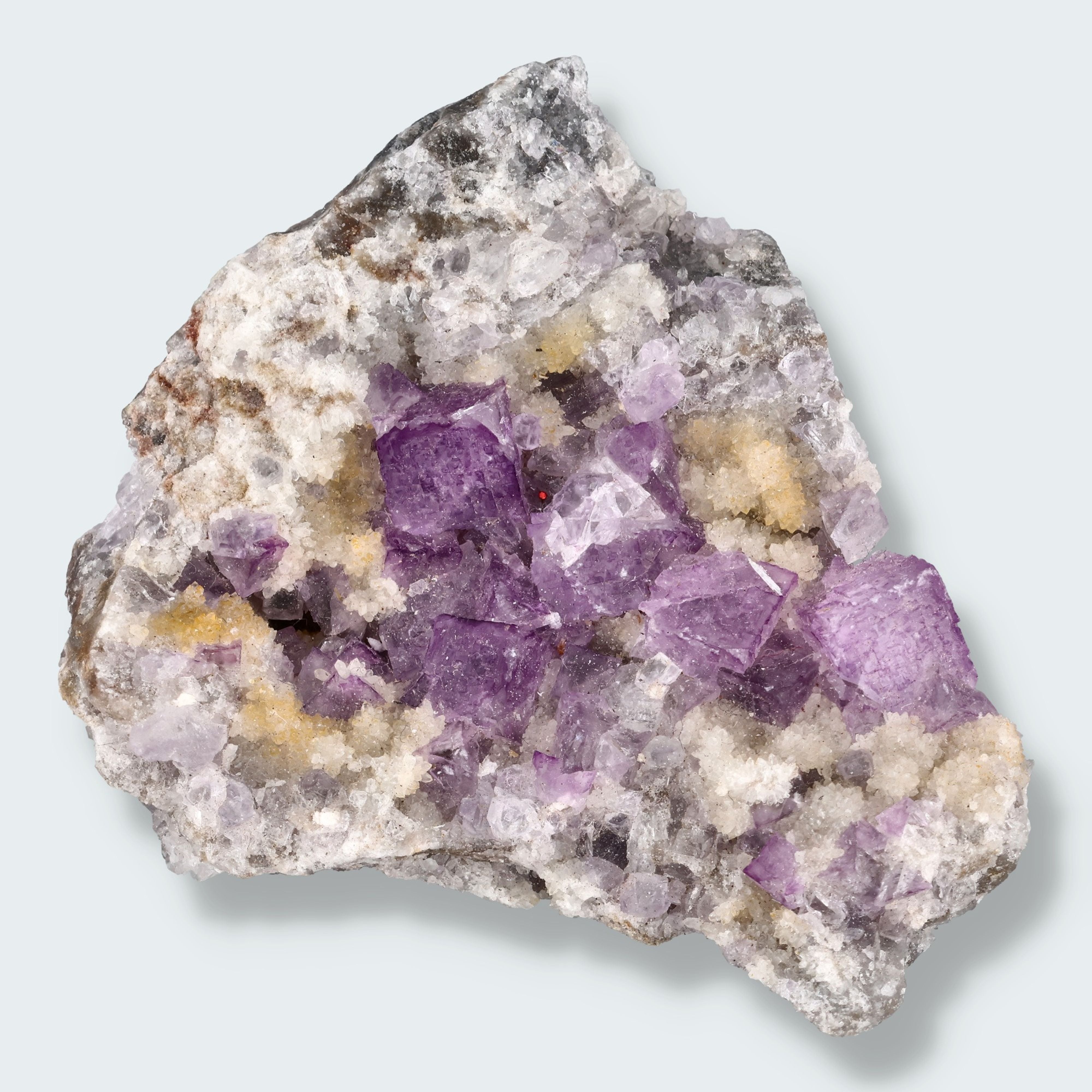 Violetter Fluorit aus Mexiko mit weissen und gelben Quarz Anlagerungen (121g)