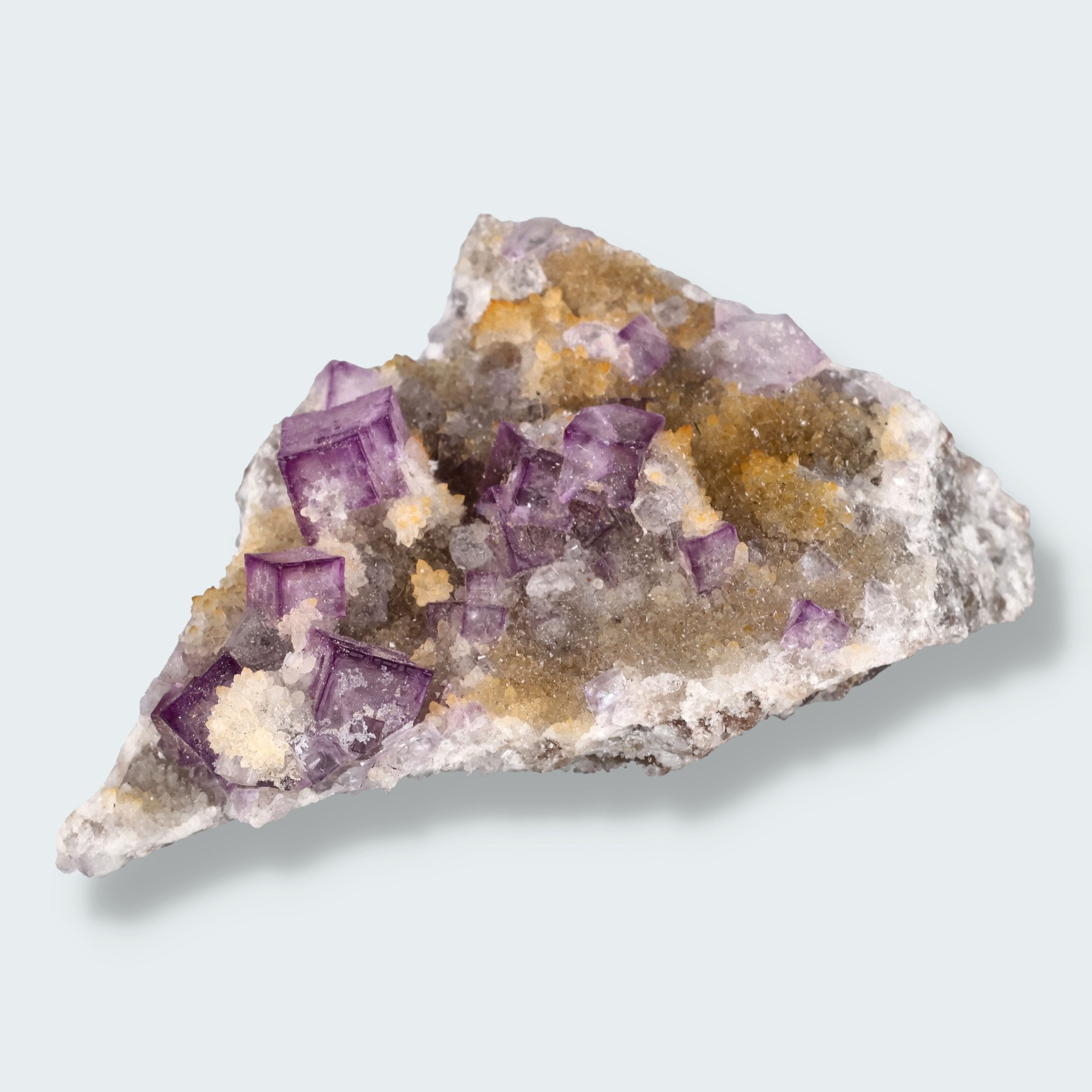 Violetter Fluorit aus Mexiko mit weissen und gelben Quarz Anlagerungen (63g)